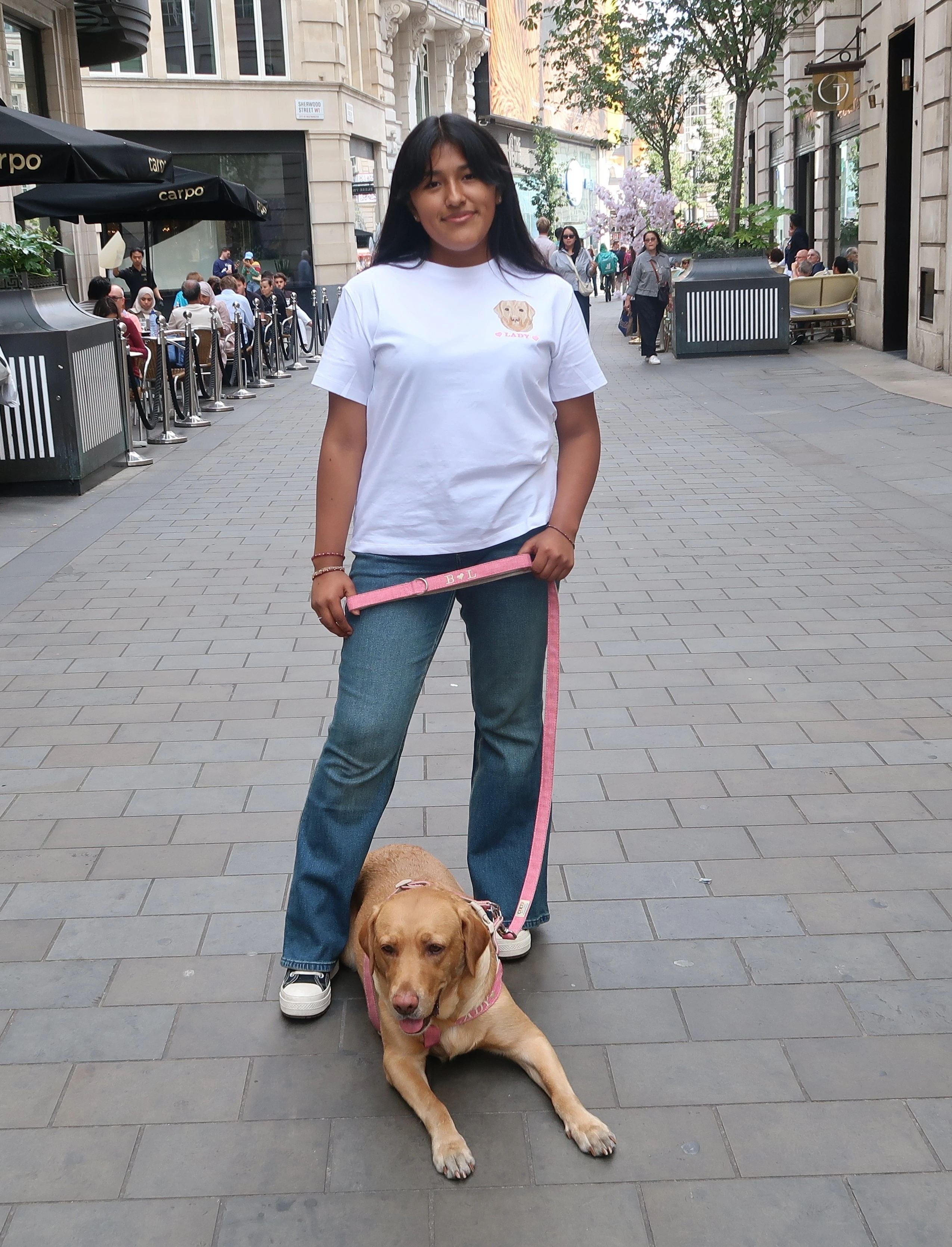 Girl with Coco pet on street